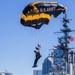 The U.S. Army Parachute Team jumps onto the USS Midway in San Diego