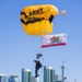 The U.S. Army Parachute Team jumps onto the USS Midway in San Diego