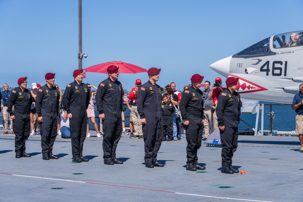 The U.S. Army Parachute Team jumps onto the USS Midway in San Diego