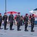 The U.S. Army Parachute Team jumps onto the USS Midway in San Diego