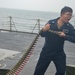 Sailors on USS Lassen Load Ammunition