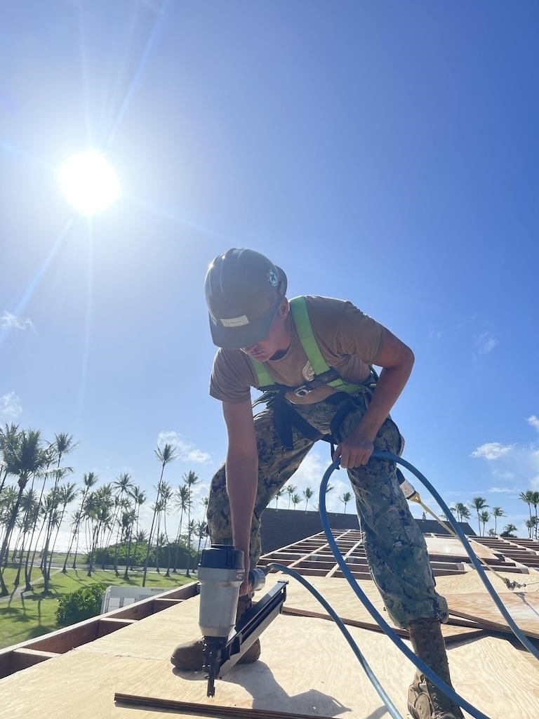 DVIDS - Images - Utilitiesman 3rd Class Michael Klemczak nails plywood ...