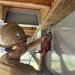 Builder 2nd Class Stephen Tritsch, secures nailers to the steel frame of the Richardson Multipurpose Facility.
