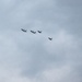 U.S. F-22s fly alongside Polish F-16s during the WWII Commemoration in Poland