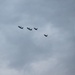 U.S. F-22s fly alongside Polish F-16s during the WWII Commemoration in Poland