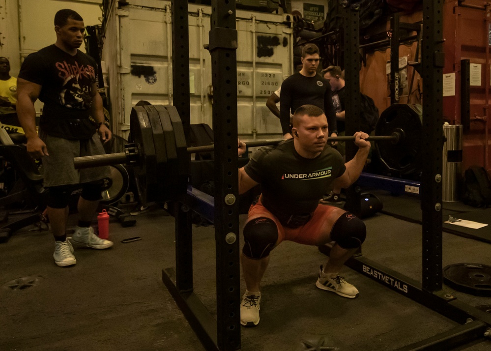 US Navy Sailors Participate in a Squat Challenge Aboard USS George H.W. Bush