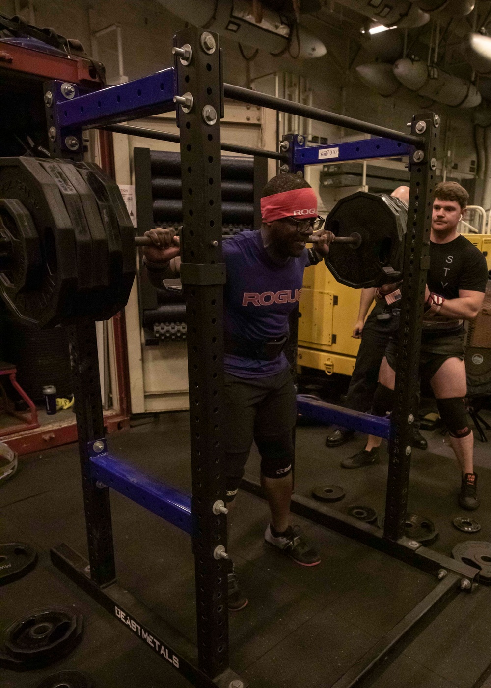 US Navy Sailors Participate in a Squat Challenge Aboard USS George H.W. Bush