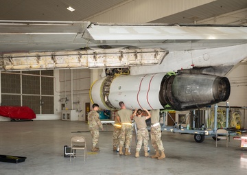 Aircraft maintainers work on E-8C Joint STARS engine