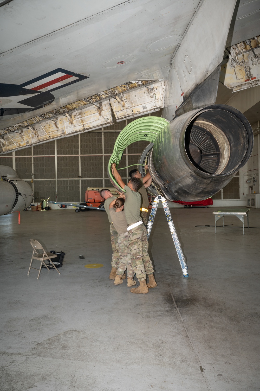 Aircraft maintainers work on E-8C Joint STARS engine