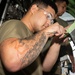 Aircraft maintainers work on E-8C Joint STARS engine