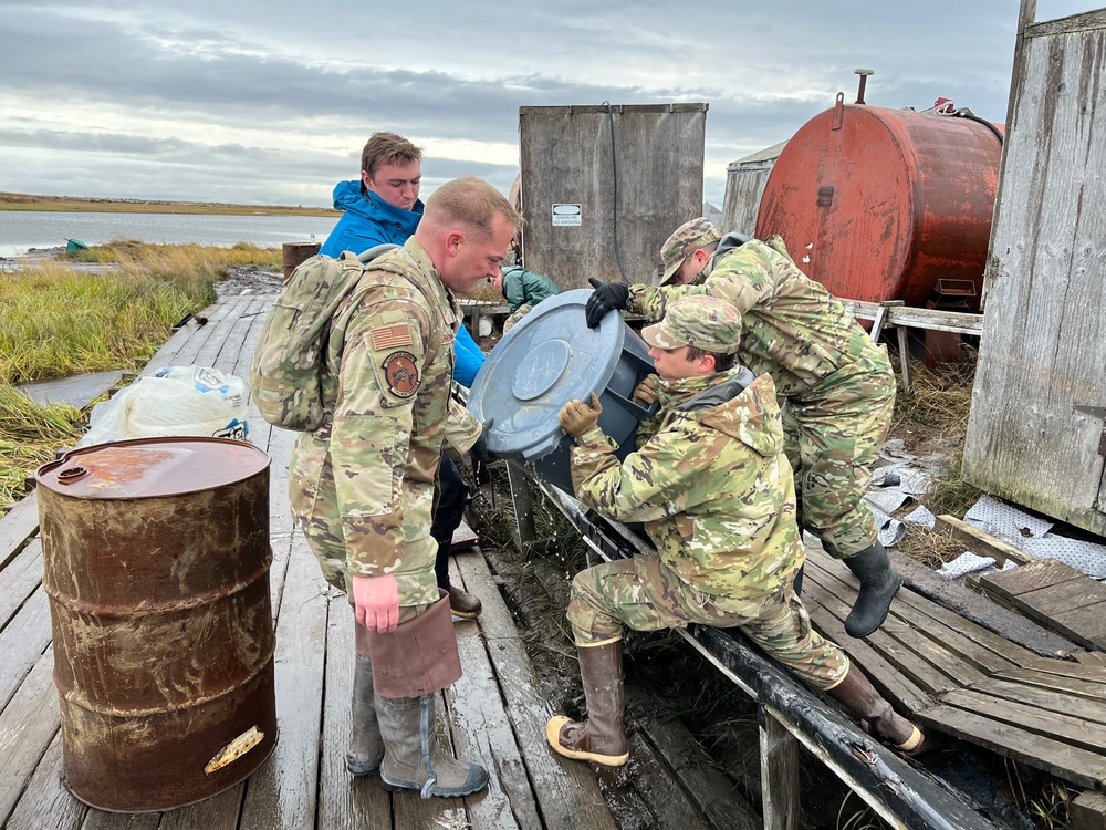 Alaska National Guardsmen of Joint Task Force-Bethel clear storm debris in Newtok, Alaska