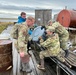 Alaska National Guardsmen of Joint Task Force-Bethel clear storm debris in Newtok, Alaska