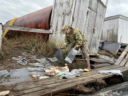 Alaska National Guardsmen of Joint Task Force-Bethel clear storm debris in Newtok, Alaska