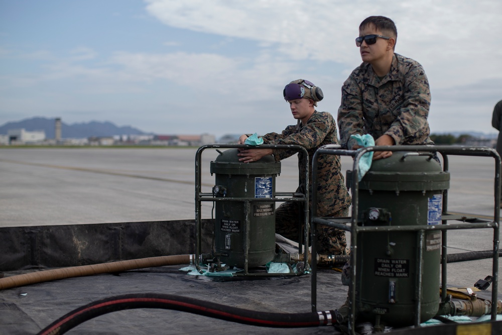 Marines with MWSS-171 refuel P-8A Poseidon