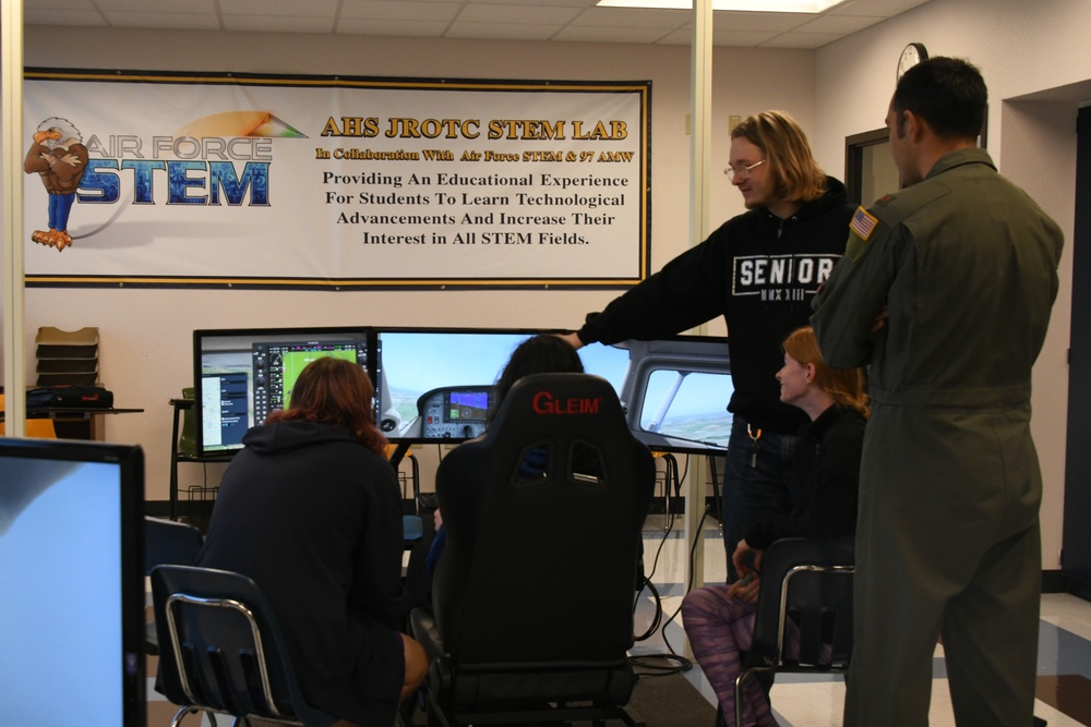 AAFB pilots educate aspiring Airmen in flight simulator program