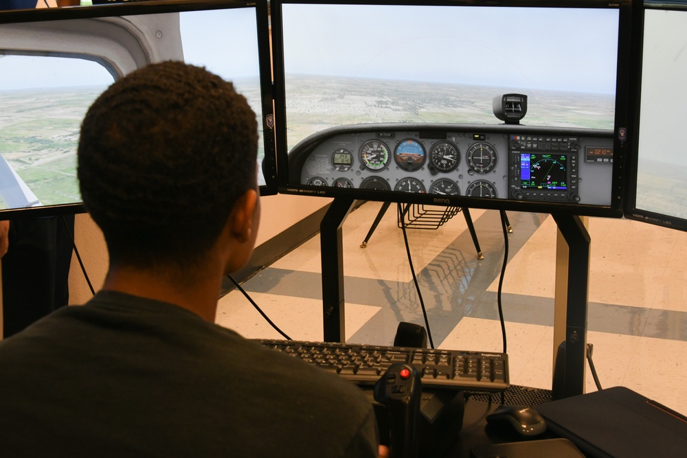 AAFB pilots educate aspiring Airmen in flight simulator program