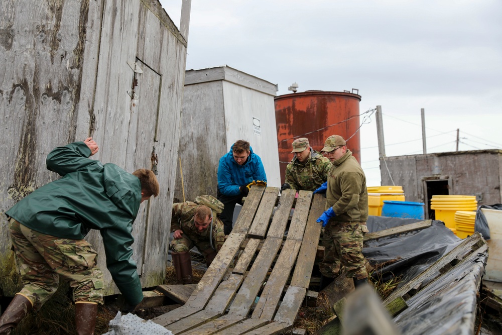 Alaska National Guardsmen in Joint Task Force-Bethel clear storm debris in Newtok, Alaska