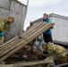 Alaska National Guardsmen in Joint Task Force-Bethel clear storm debris in Newtok, Alaska