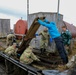 Alaska National Guardsmen in Joint Task Force-Bethel clear storm debris in Newtok, Alaska