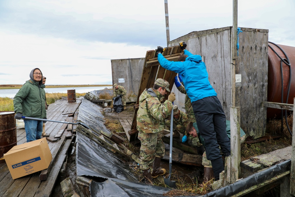 Alaska National Guardsmen in Joint Task Force-Bethel clear storm debris in Newtok, Alaska