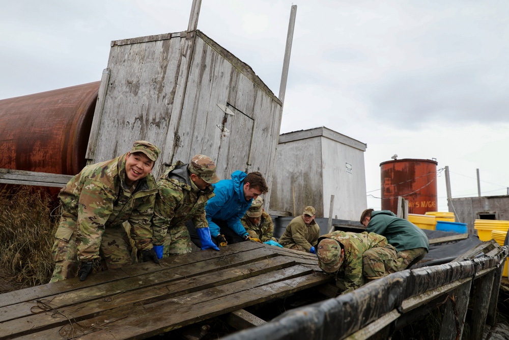 Alaska National Guardsmen in Joint Task Force-Bethel clear storm debris in Newtok, Alaska