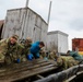 Alaska National Guardsmen in Joint Task Force-Bethel clear storm debris in Newtok, Alaska