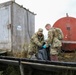 Alaska National Guardsmen in Joint Task Force-Bethel clear storm debris in Newtok, Alaska