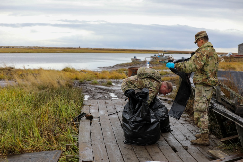 Alaska National Guardsmen in Joint Task Force-Bethel clear storm debris in Newtok, Alaska