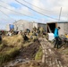 Alaska National Guardsmen in Joint Task Force-Bethel clear storm debris in Newtok, Alaska