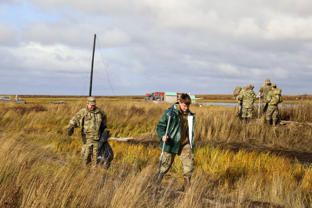 Alaska National Guardsmen in Joint Task Force-Bethel clear storm debris in Newtok, Alaska