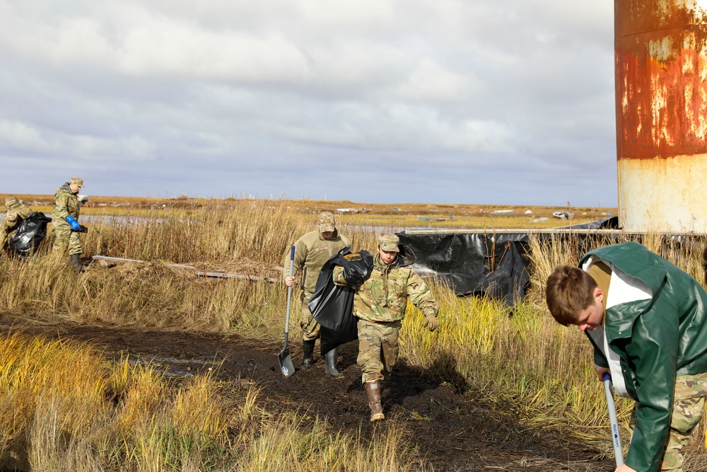 Alaska National Guardsmen in Joint Task Force-Bethel clear storm debris in Newtok, Alaska