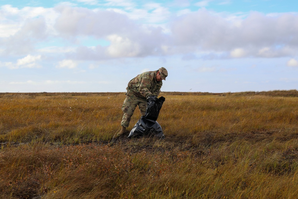 Alaska National Guardsmen in Joint Task Force-Bethel clear storm debris in Newtok, Alaska