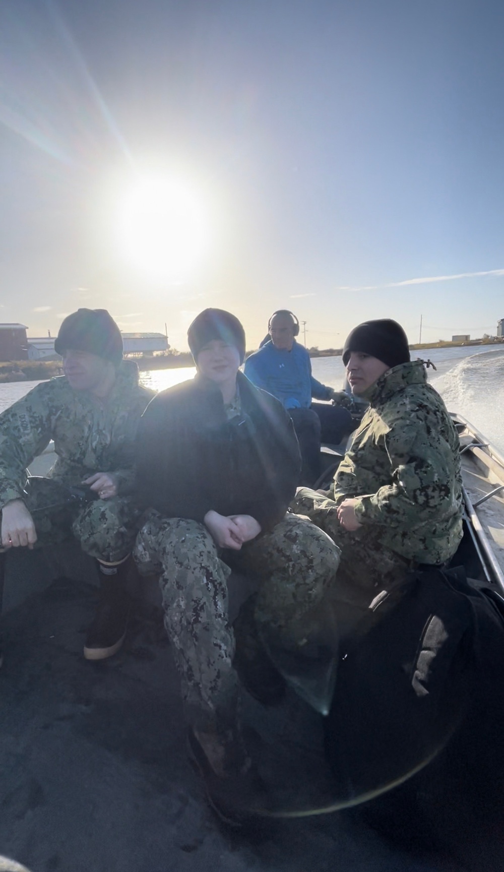 Service members of Joint Task Force-Bethel clear storm debris in Nightmute, Alaska for Operation Merbok Response