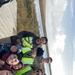 Service members of Joint Task Force-Bethel clear storm debris in Nightmute, Alaska for Operation Merbok Response