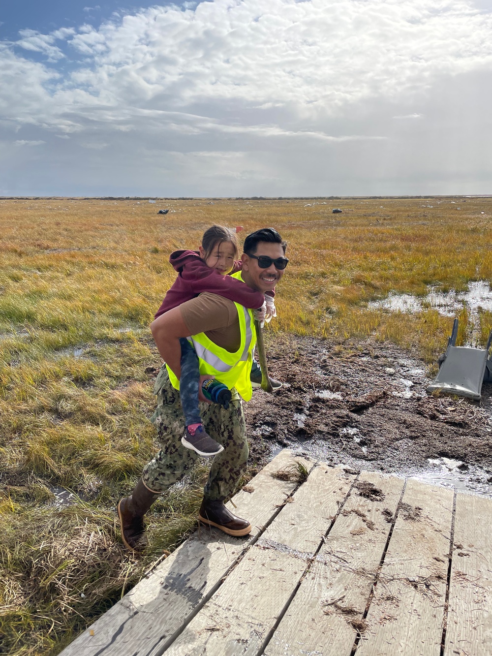 Service members of Joint Task Force-Bethel clear storm debris in Nightmute, Alaska for Operation Merbok Response