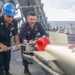 Sailors Load Torpedo