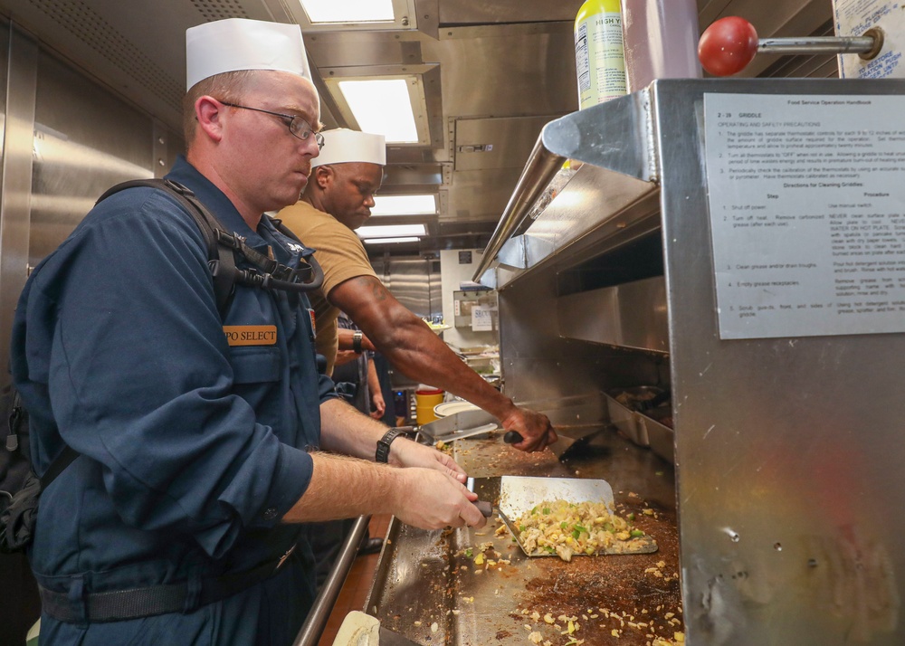 Culinary Specialist Prepares Meal