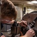 Machinery Repairman Measures Pipe