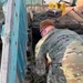 Service members of the Alaska Organized Militia repair infrastructure for Operation Merbok Response