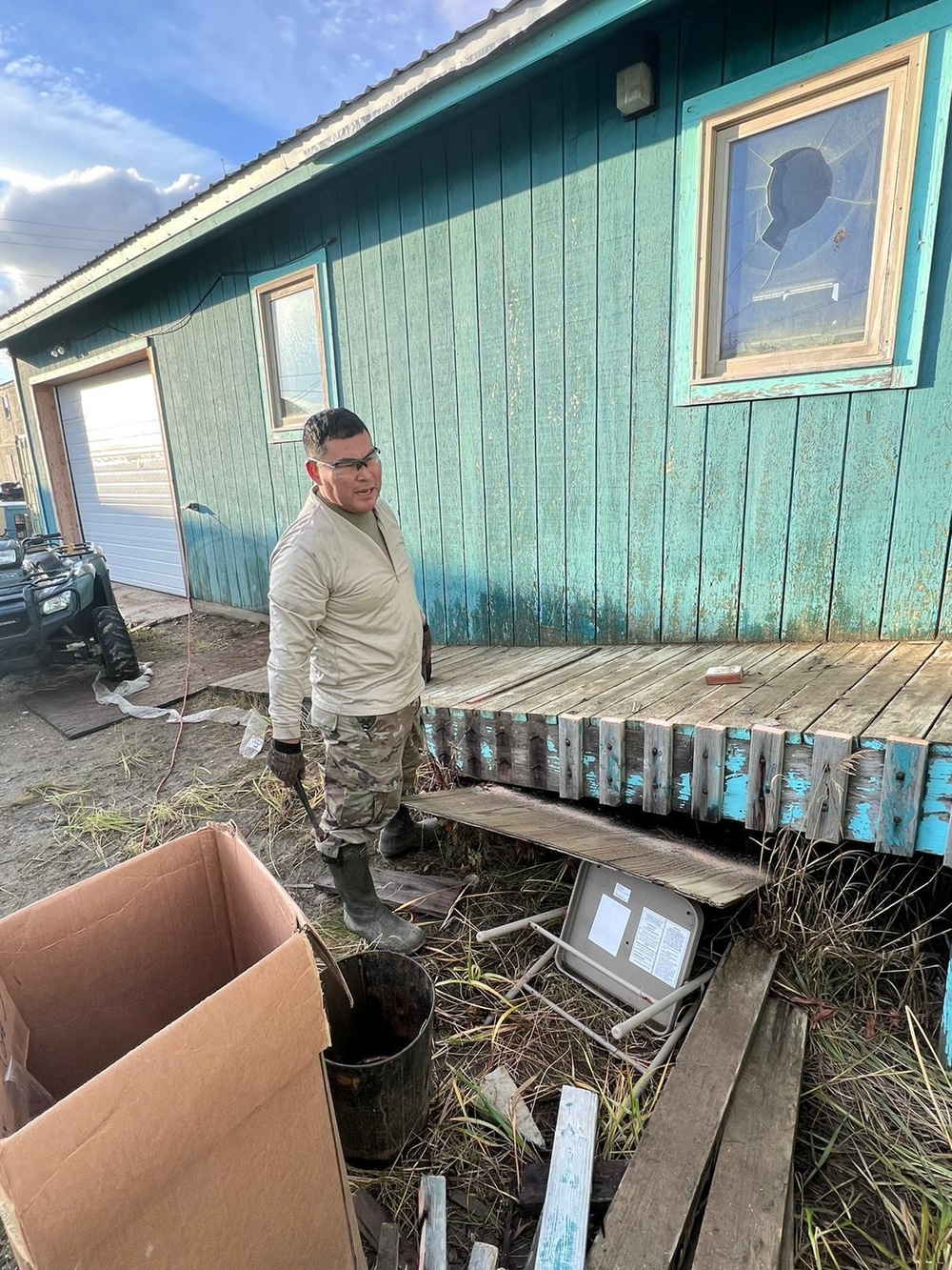 A service member of the Alaska Organized Militia repairs infrastructure for Operation Merbok Response