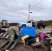 Service members of the Alaska Organized Militia clear storm debris for Operation Merbok Response