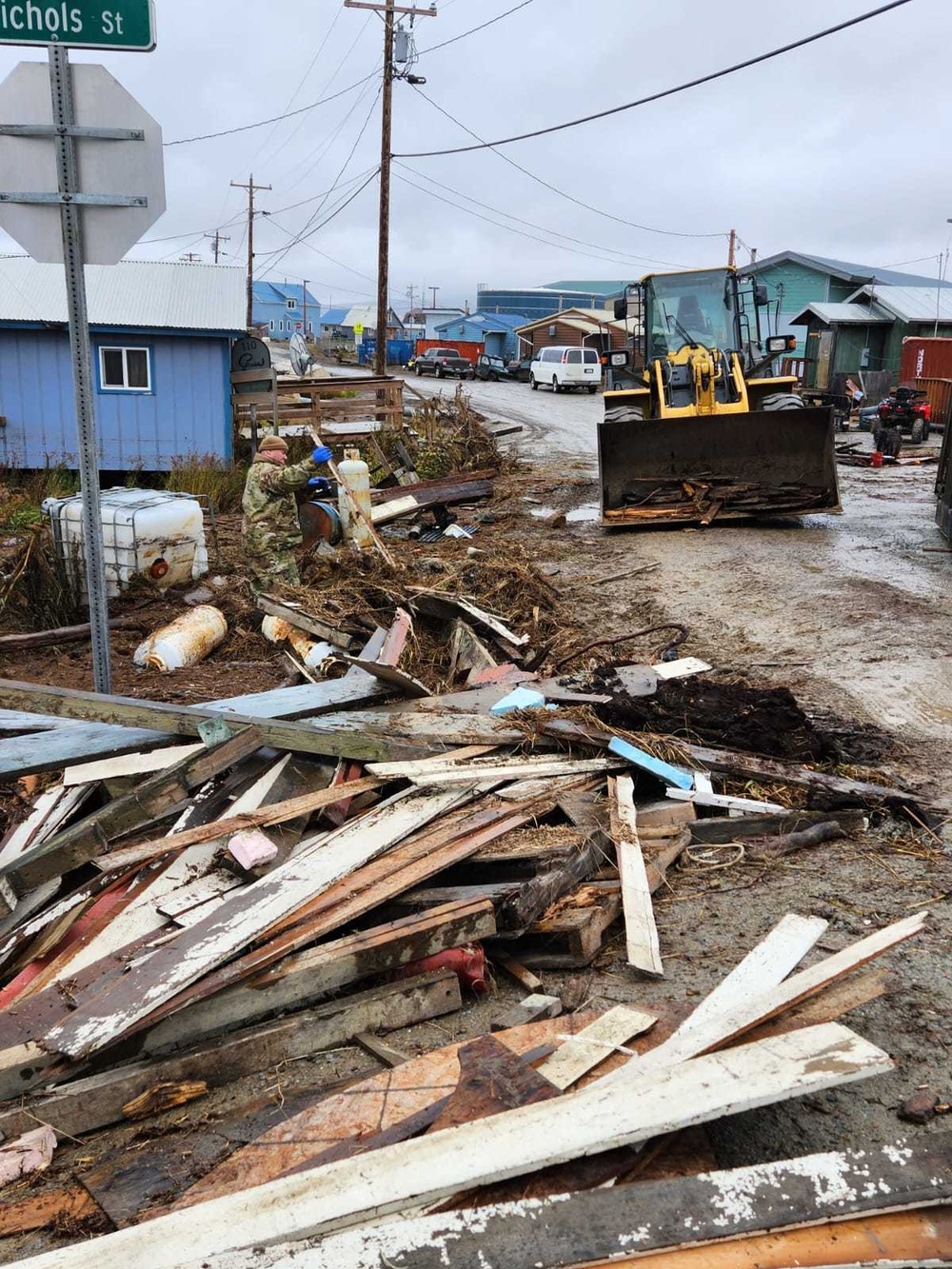 Service members of the Alaska Organized Militia clear storm debris for Operation Merbok Response