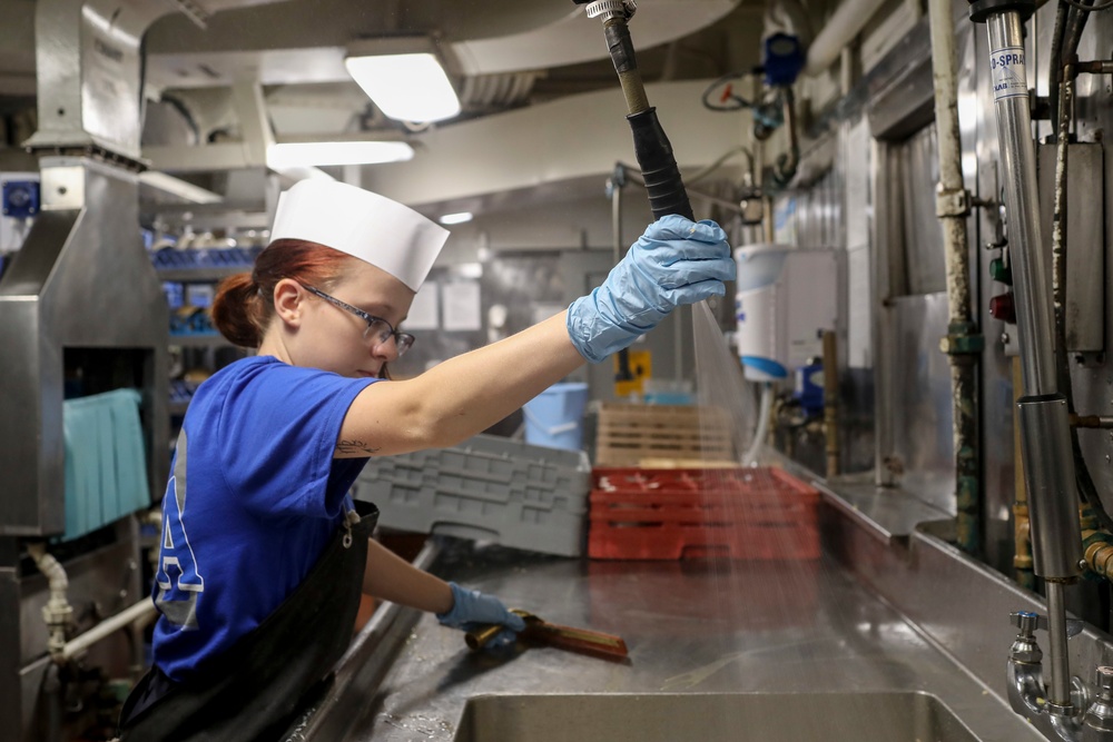 Abraham Lincoln Sailor Cleans Sink