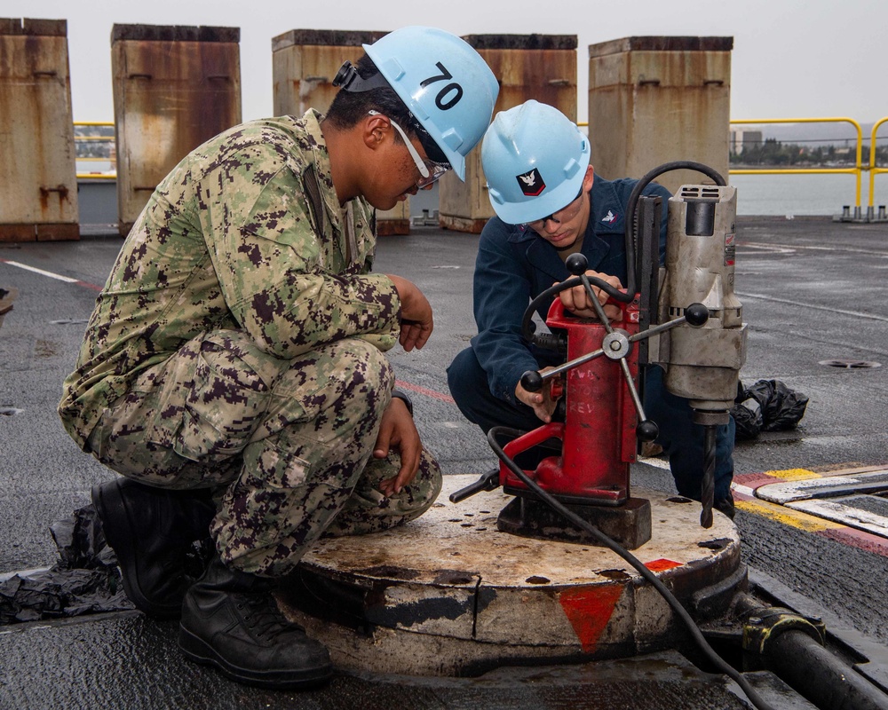 USS Carl Vinson Sailors Tap Out Equipment