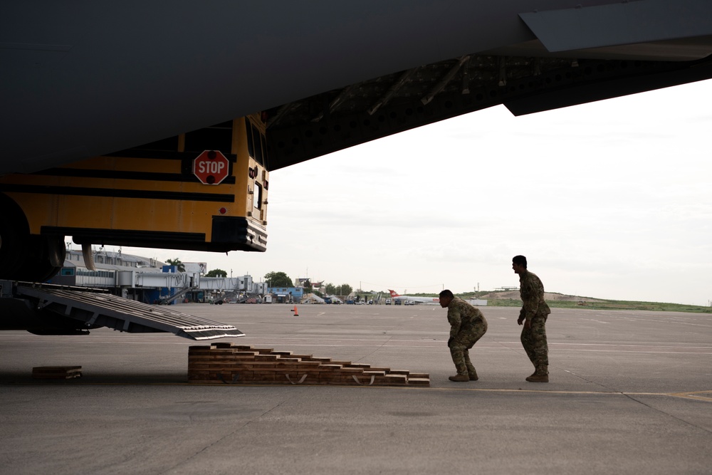 349th Air Mobility Wing delivers buses to Haiti