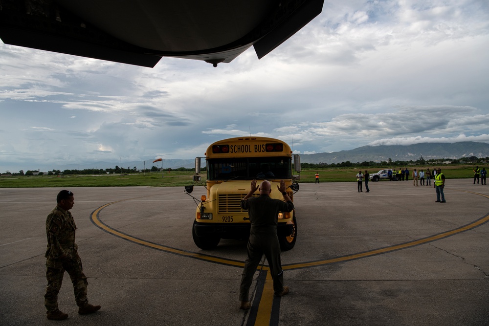 349th Air Mobility Wing delivers buses to Haiti
