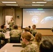 Maj. Paul Wooster speaks to ASCBC students