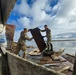 Service members in Joint Task Force - Bethel assist the community of Chevak, Alaska in storm recovery efforts for Operation Merbok Response