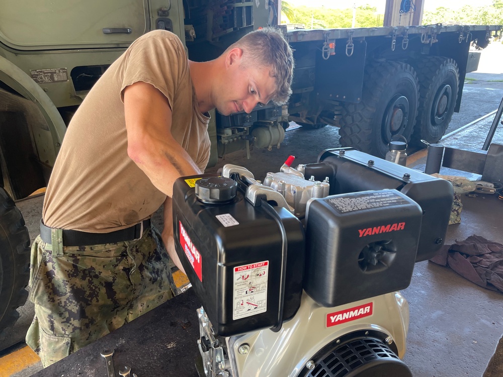 NMCB-11 Seabees Install Crate Motor on a Globe Trailer