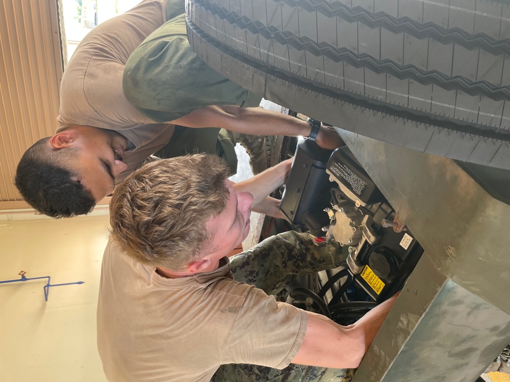 NMCB-11 Seabees install Yanmar Crate Motor on Globe Trailer